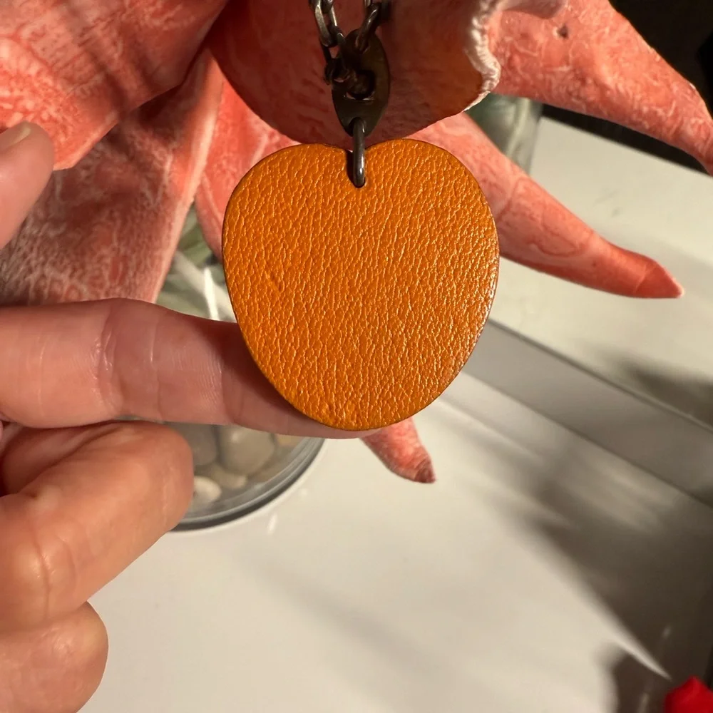 Hermes- AUTHENTIC 🍀 Orange Leather Fruit Charm with Green Leaf